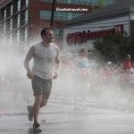 Runners cool off during a hot Peachtree Road Race in Atlanta