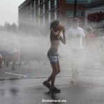 Runners cool off during a hot Peachtree Road Race in Atlanta