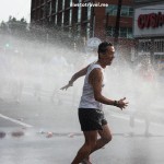 Runners cool off during a hot Peachtree Road Race in Atlanta