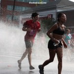 Runner cooling off during the Peachtree Road Race in Atlanta