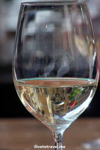 White wine from Italy with Campo de Fiore reflected