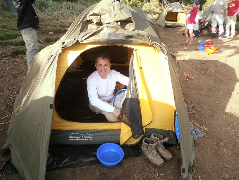 Trekker at camp in Kilimanjaro