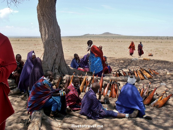 Masai women with the containers to store cow's milk and blood