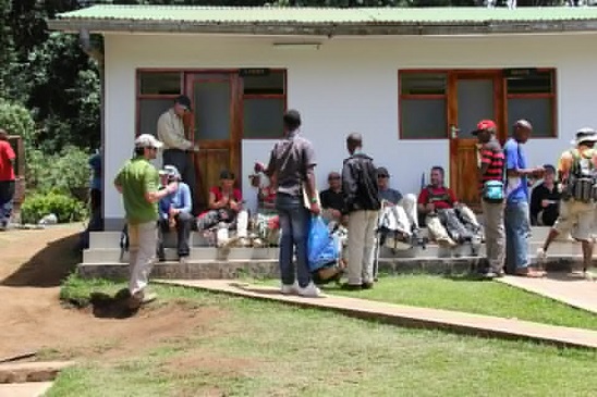 At Mweka Gate waiting for our certificates for our climb of Kilimanjaro