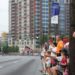 Spectators for Atlanta's Peachtree Road Race lining up Peachtree Street